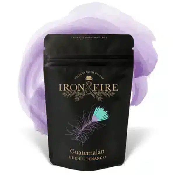 black bag of coffee with a purple swish behind it