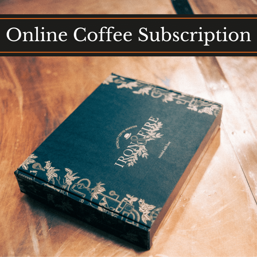 Online Coffee Subscription, an Iron & Fire gift box on a wooden table